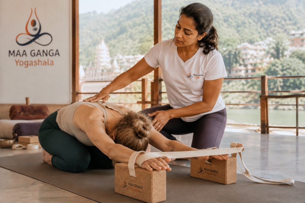 instructor using props highlighting the yoga teacher training flexibility required myth